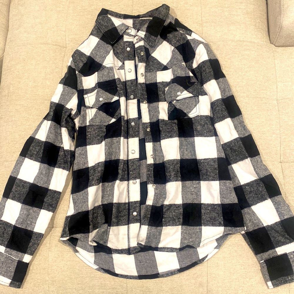 Plaid button down shirt.